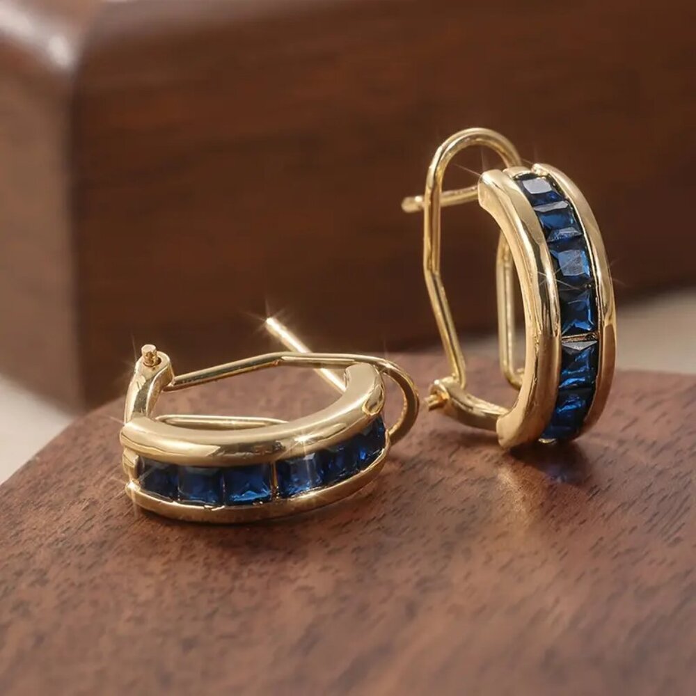 NEW blue channel set CZ omega back earrings gold tone
